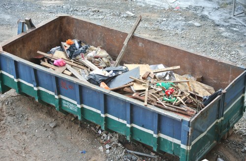 Front view of a commercial waste truck operating in Carshalton with accessibility symbol overlay