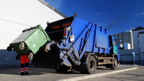 Van and crew loading commercial waste on Carshalton High Street