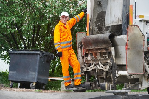 Inspector reviewing a commercial waste quote on site