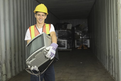 Person using a screen reader to access commercial waste removal information on a laptop